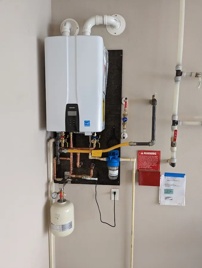 Professional plumber installing copper piping in a Falfurrias home